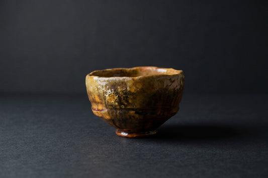 Irregular tea bowl with rich amber glaze — The Presence of Imperfection