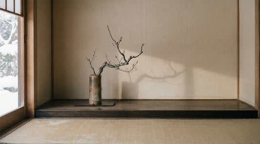 Plum branch in bamboo vase on tokonoma alcove with snow light — The Wealth of Poverty
