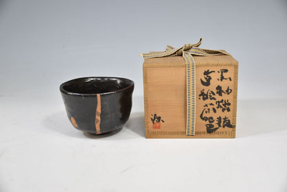 Kuro-yu Yakimuke Chawan — Black Glaze Resist Matcha Bowl with Grass Motif, Tomobako