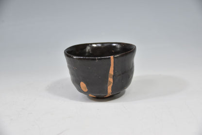 Kuro-yu Yakimuke Chawan — Black Glaze Resist Matcha Bowl with Grass Motif, Tomobako
