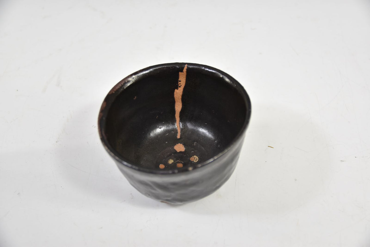Kuro-yu Yakimuke Chawan — Black Glaze Resist Matcha Bowl with Grass Motif, Tomobako