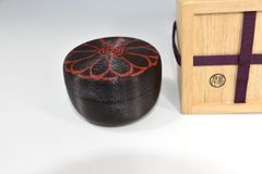 Kuro-yu Yakimuke Chawan — Black Glaze Resist Matcha Bowl with Grass Motif, Tomobako