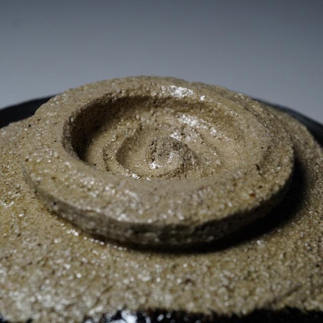 Ogawa Choraku Black Raku Tea Bowl with Do-jime Waist and Twisted Carving