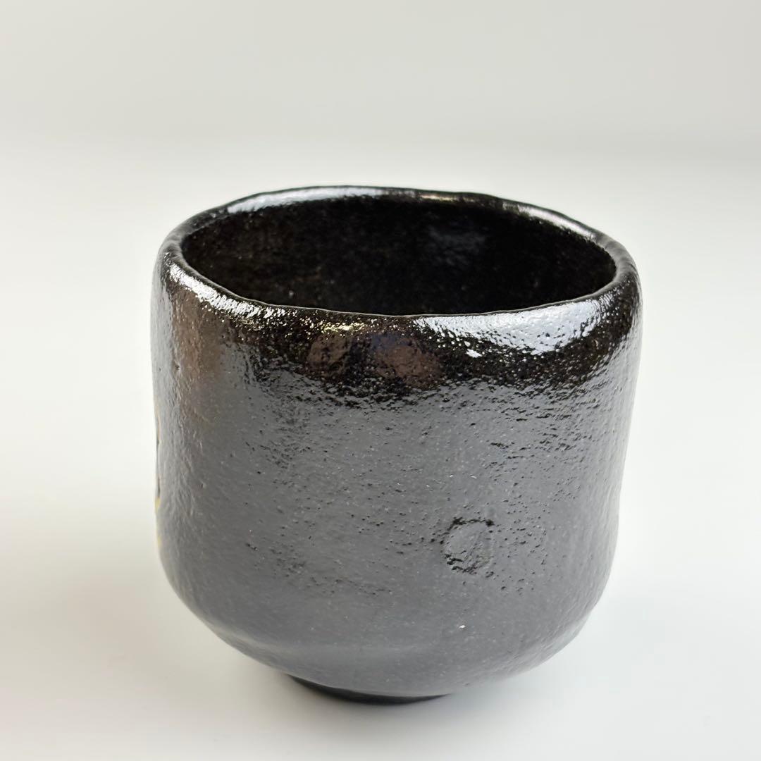 Kuro Raku Chawan by Sasaki Shoraku — Chonyu-Style Black Tea Bowl with Gold Flame Motif, Signed by Fukumoto Sekio of Daitoku-ji