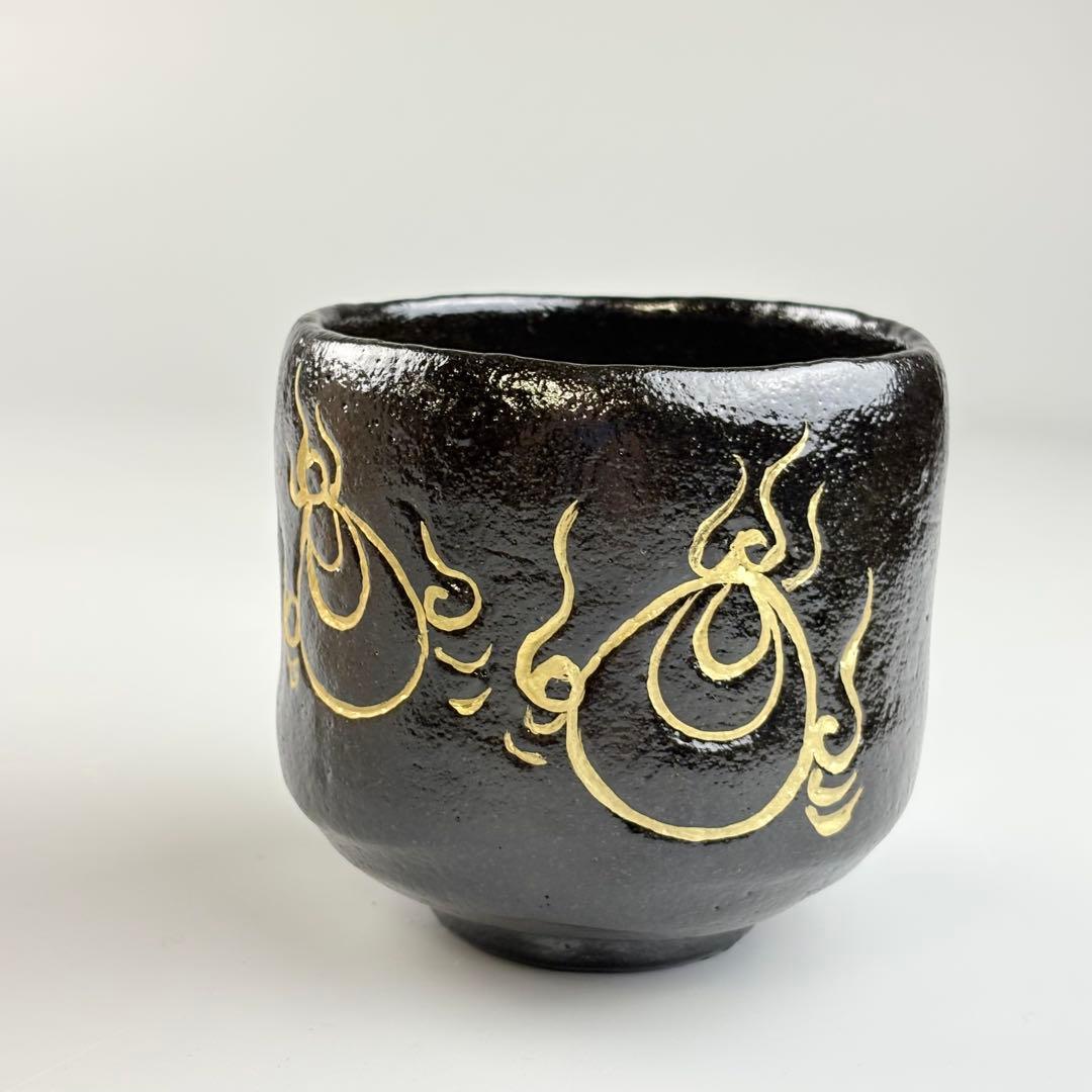 Kuro Raku Chawan by Sasaki Shoraku — Chonyu-Style Black Tea Bowl with Gold Flame Motif, Signed by Fukumoto Sekio of Daitoku-ji