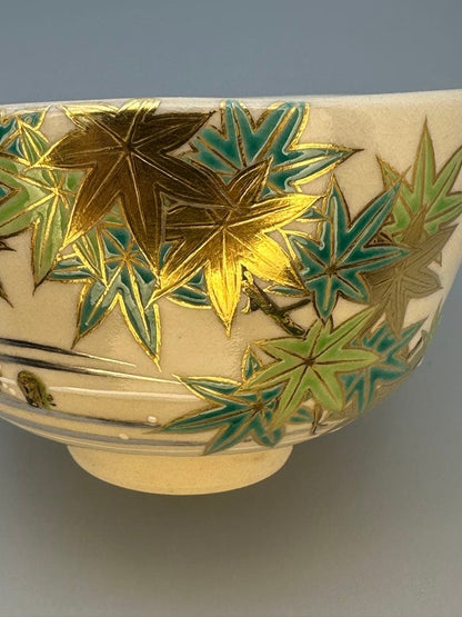 Makuzu Kōsai (Miyagawa Kōsai) Tea Bowl — Green Maple Leaves, Gold on Cream, Kyoto Pottery