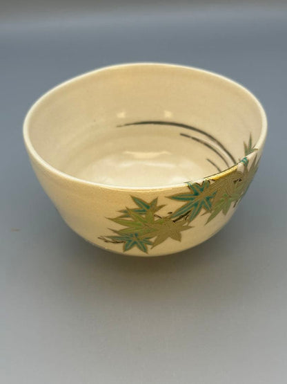 Makuzu Kōsai (Miyagawa Kōsai) Tea Bowl — Green Maple Leaves, Gold on Cream, Kyoto Pottery