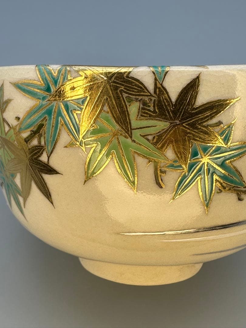 Makuzu Kōsai (Miyagawa Kōsai) Tea Bowl — Green Maple Leaves, Gold on Cream, Kyoto Pottery